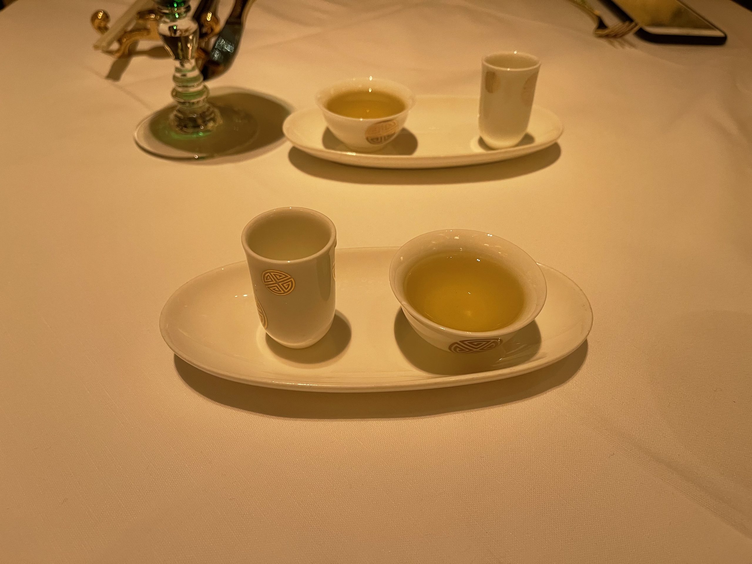 a tray of tea cups and glasses on a table