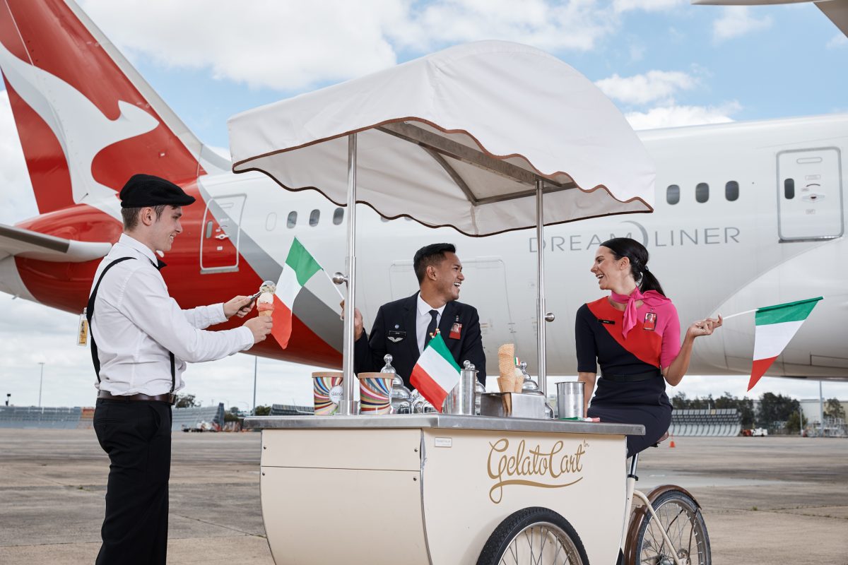 a group of people standing next to a cart