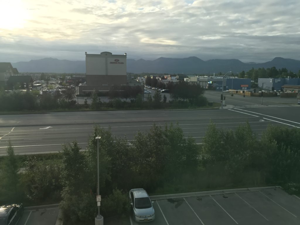 a parking lot with a building in the background