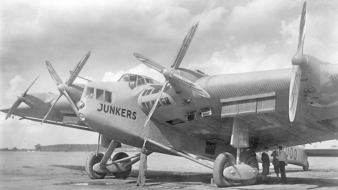 a man standing next to an airplane