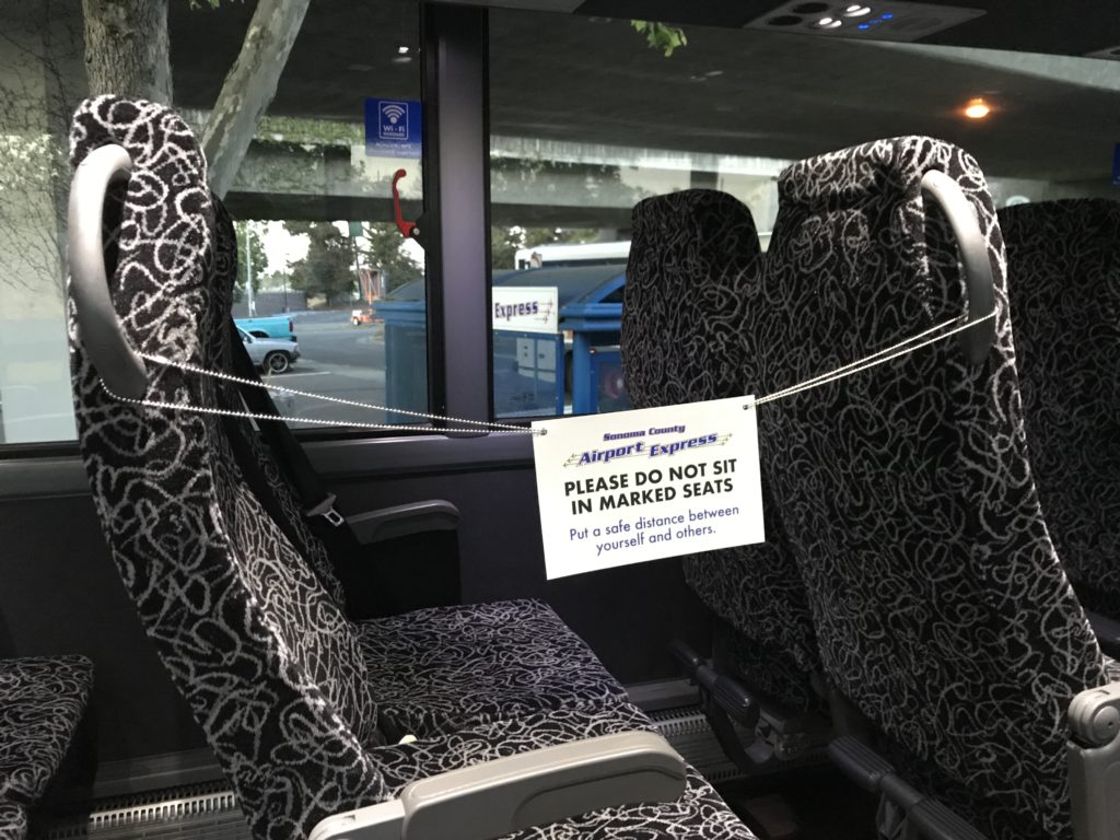 a seat with a sign attached to it