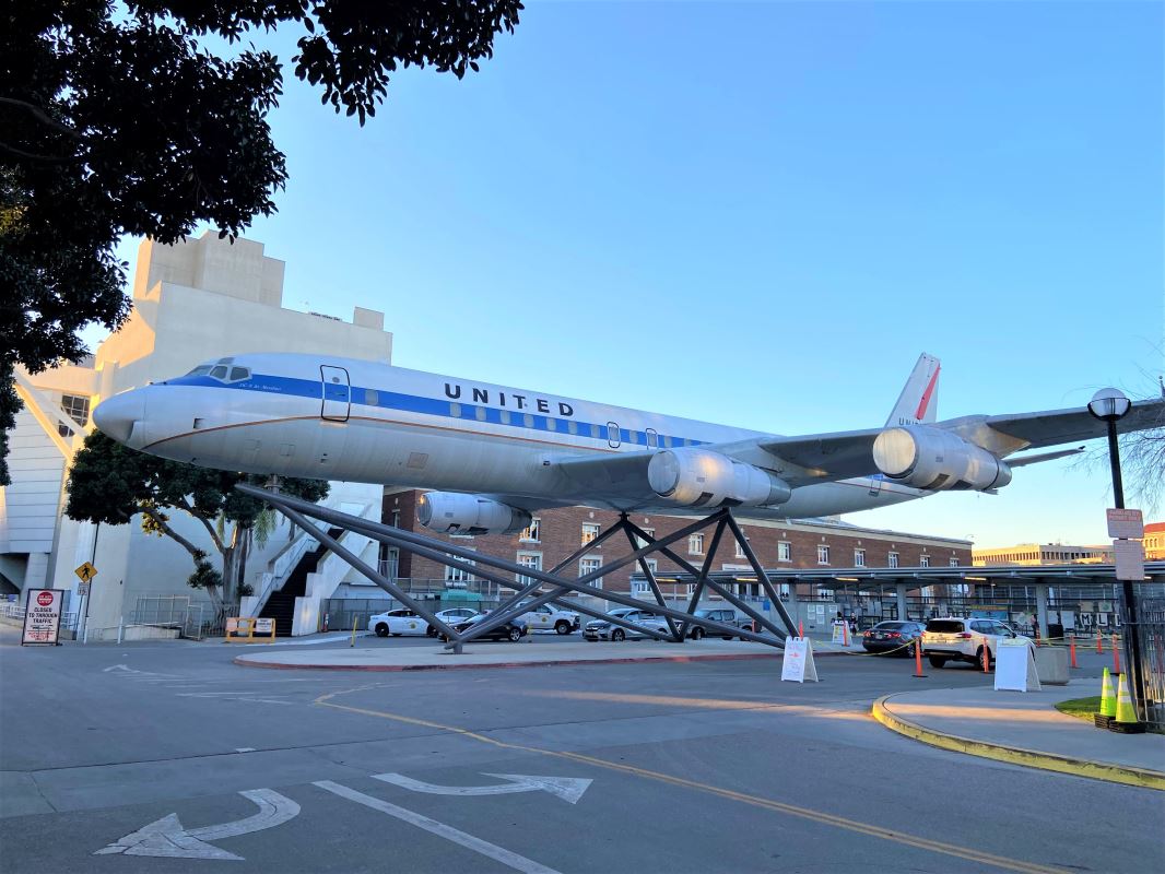 a plane on display in a parking lot