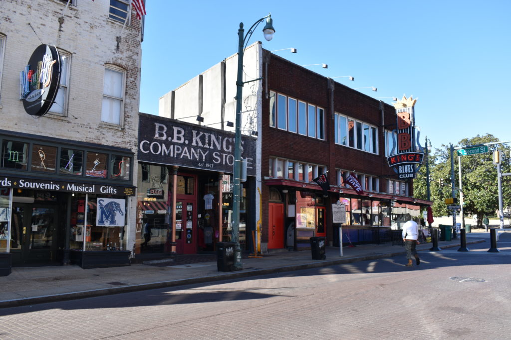 a street with shops and stores on the side