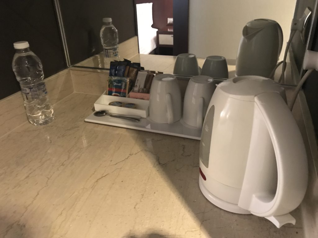 a coffee pot and coffee maker on a counter