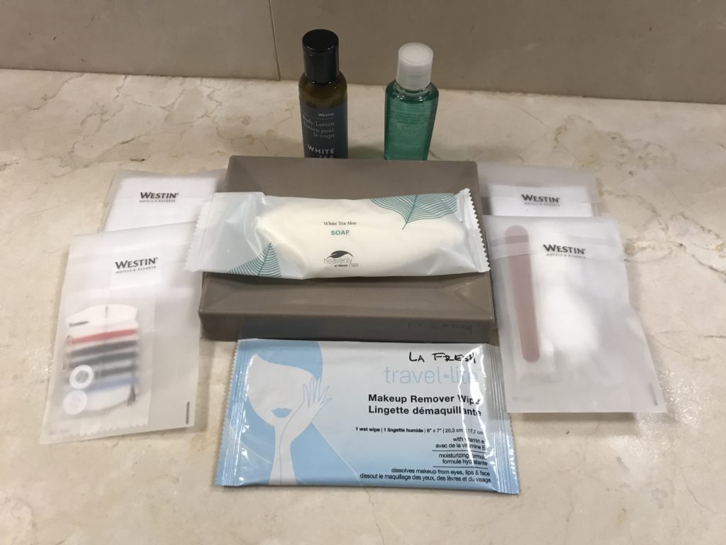 a group of toiletries and a few small bottles of makeup remover