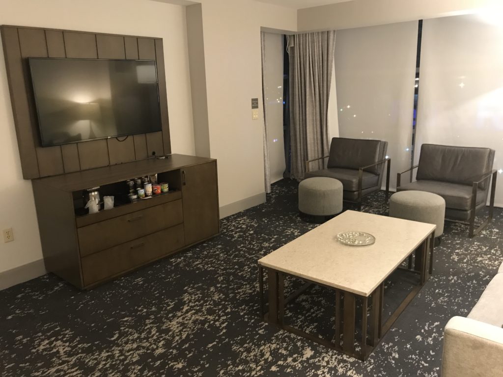 a room with a television and a table