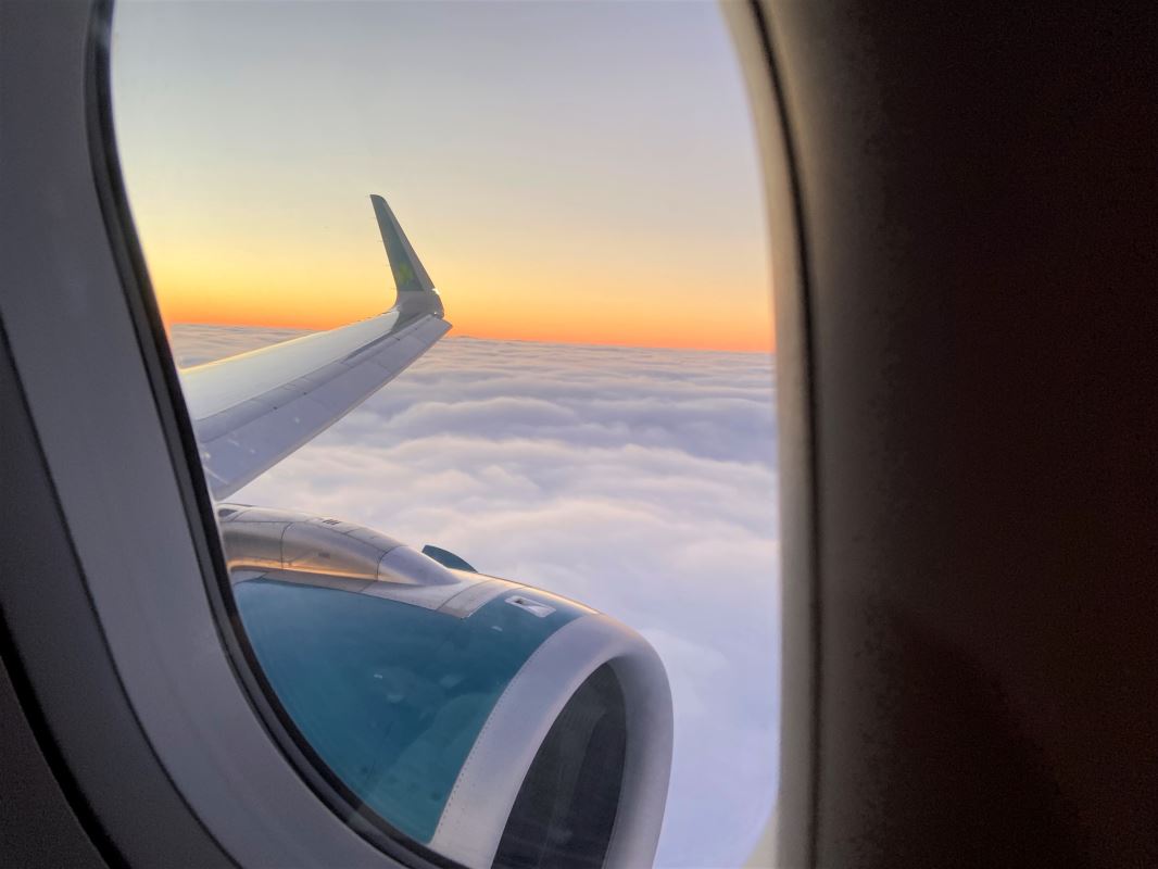 an airplane wing above clouds