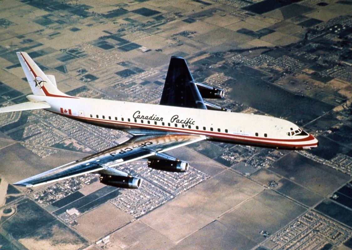 an airplane flying over a city