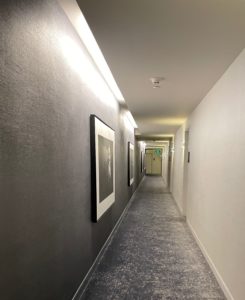 a long hallway with pictures on the wall
