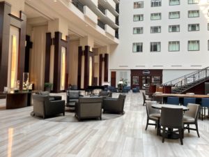 a large lobby with chairs and tables