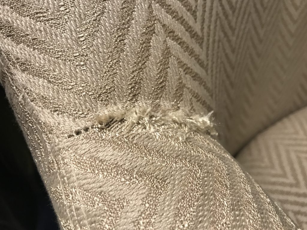 a torn fabric with a pattern