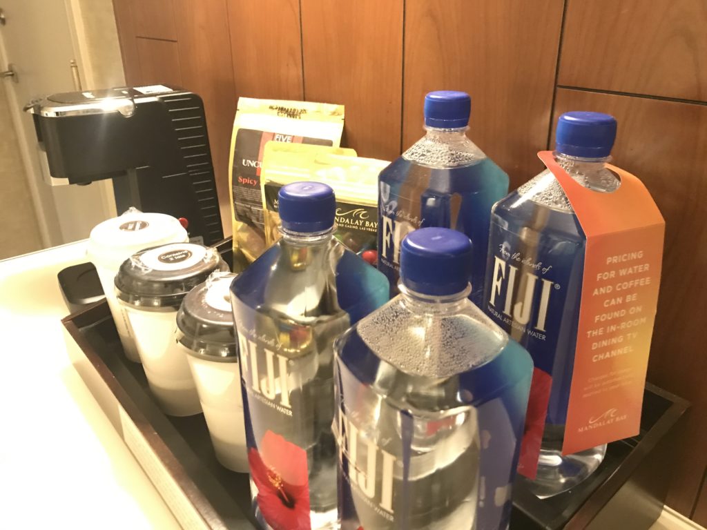 a group of plastic bottles and cups on a table