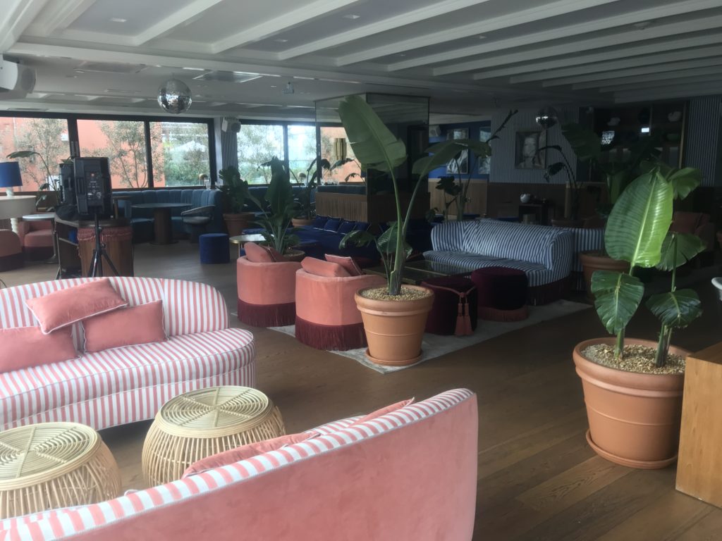 a room with couches and plants