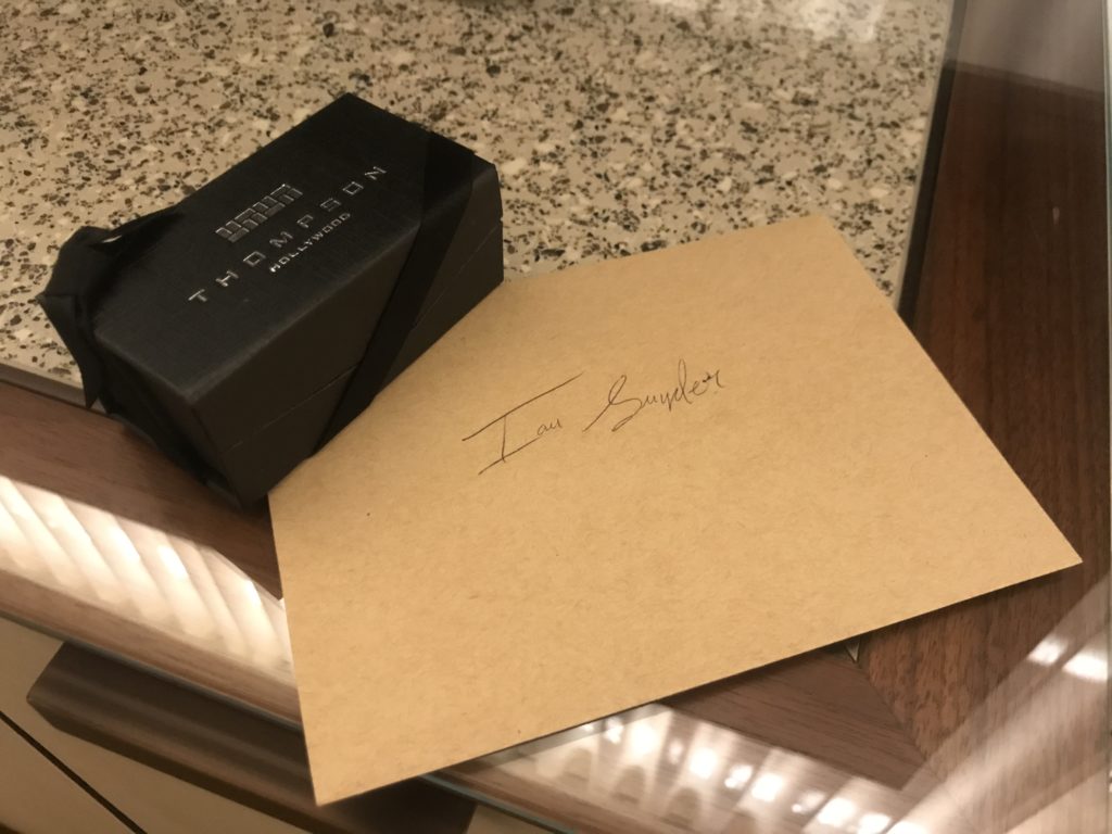 a black box and a piece of paper on a table