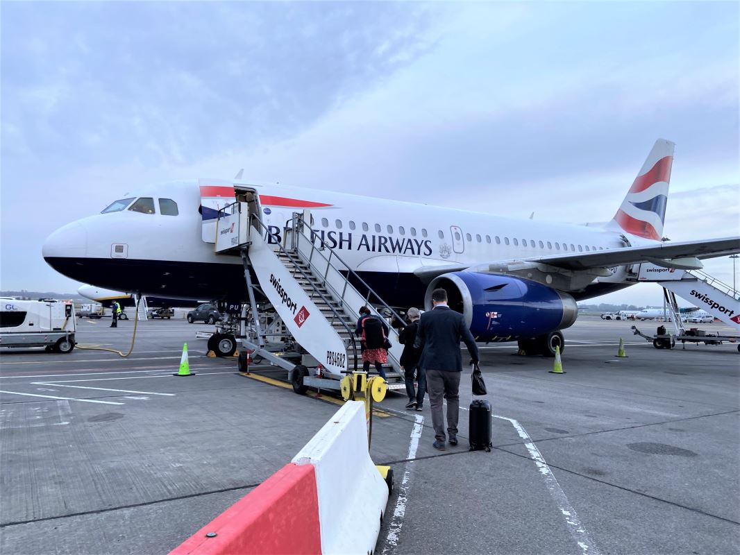 a plane with people boarding