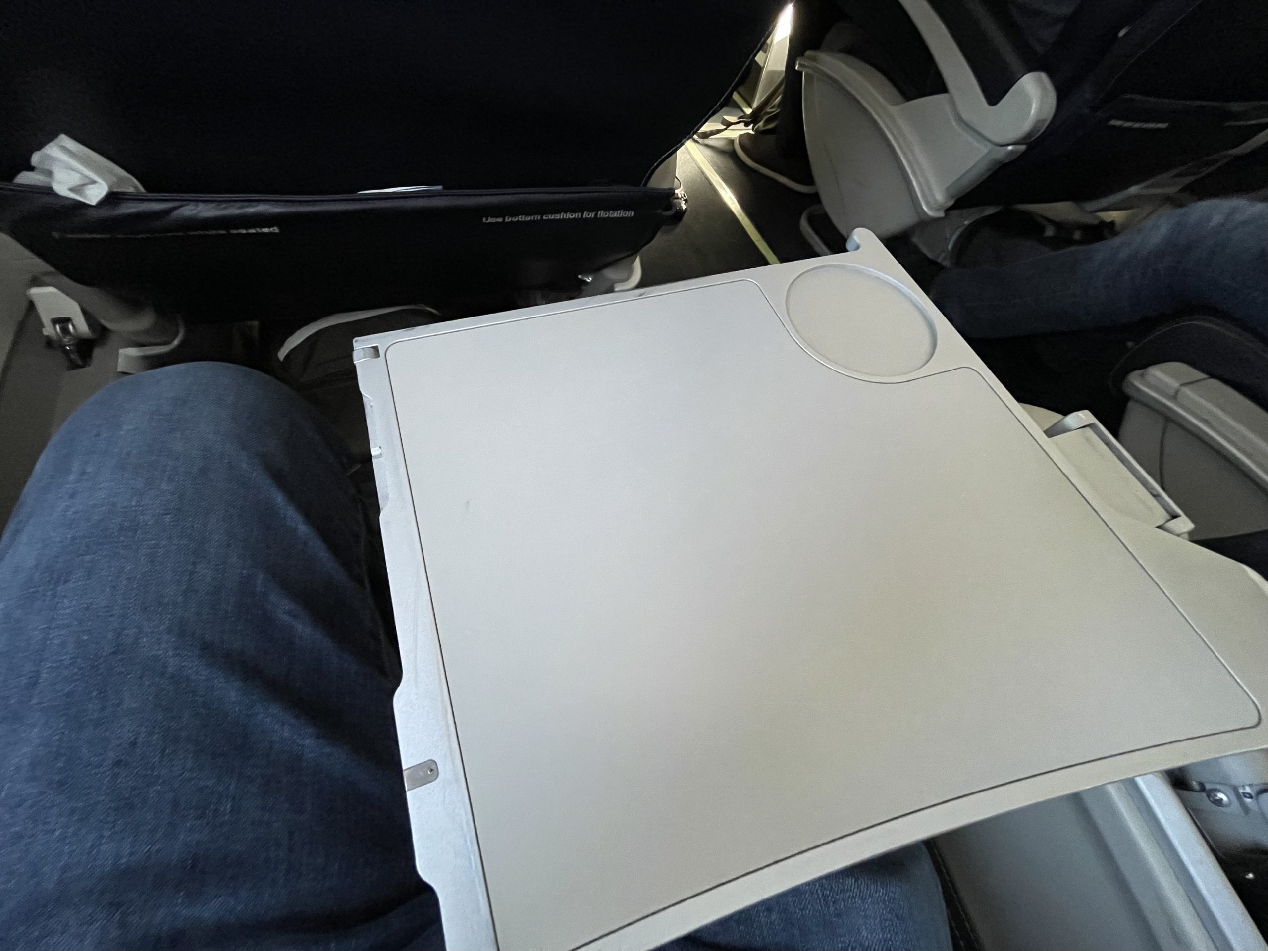 a white piece of paper on a person's lap