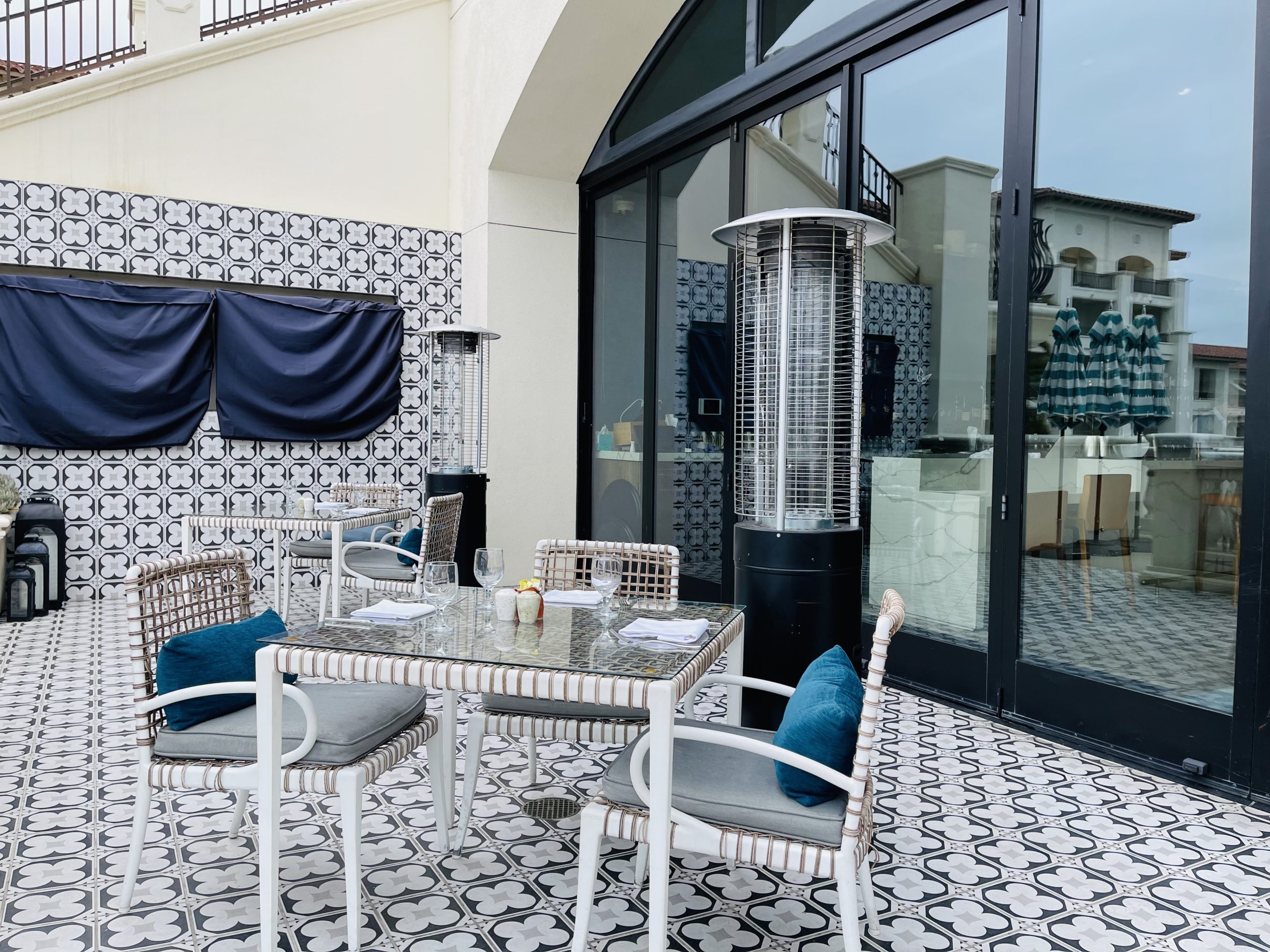 a table and chairs outside of a building