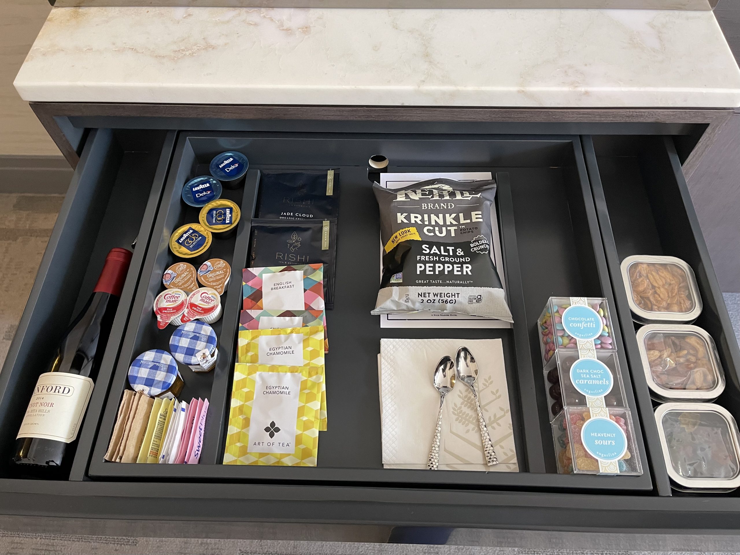 a drawer with food items and a knife