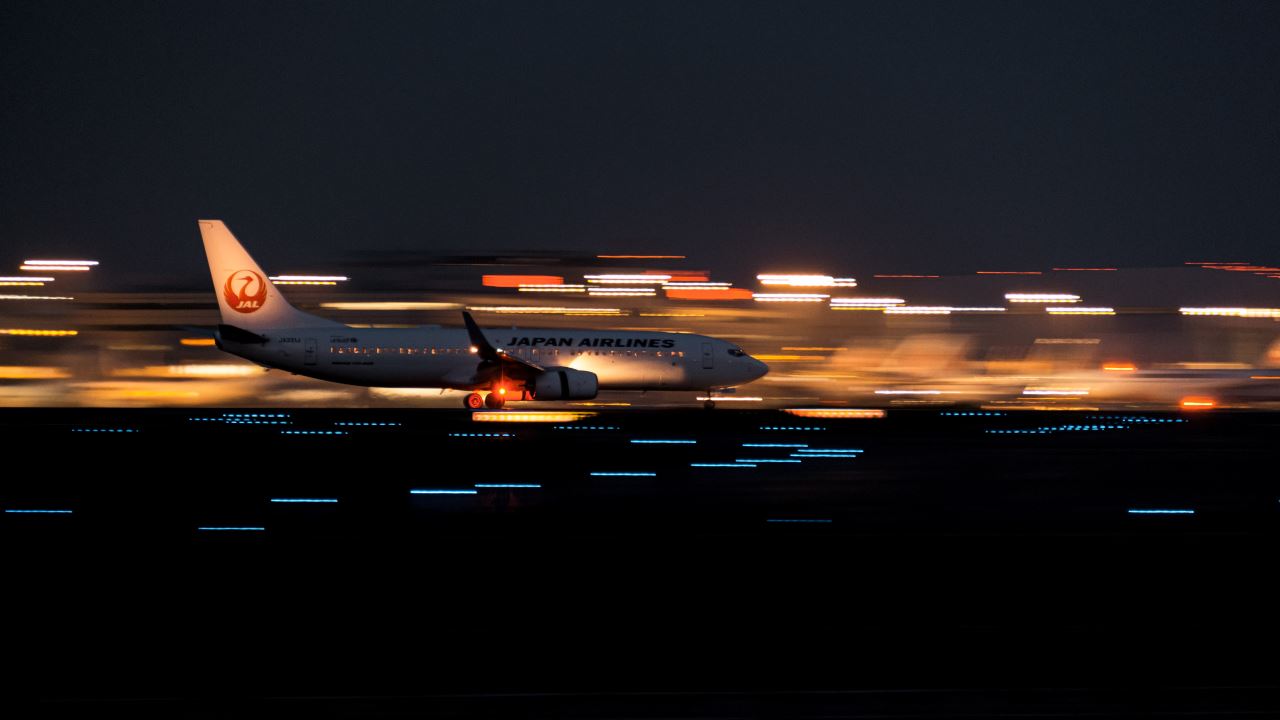 a plane on the runway at night