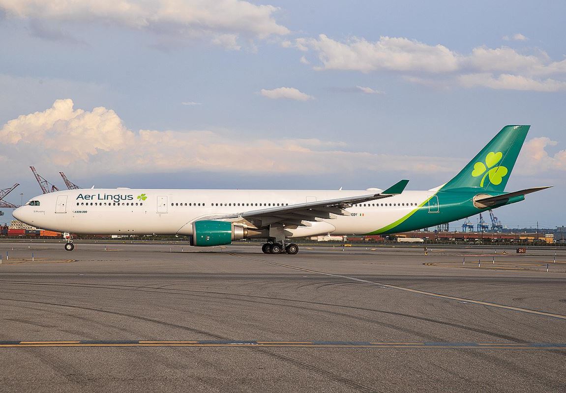 a large white airplane on a runway