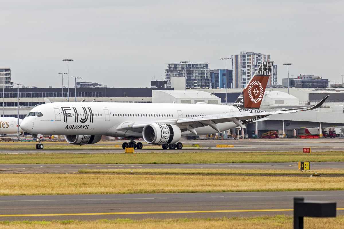 a white airplane on a runway