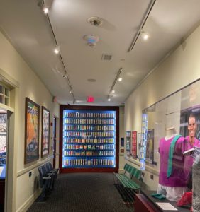 a hallway with a display case of beverages