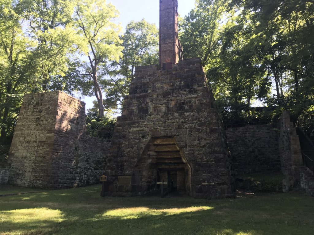 a stone structure with a chimney