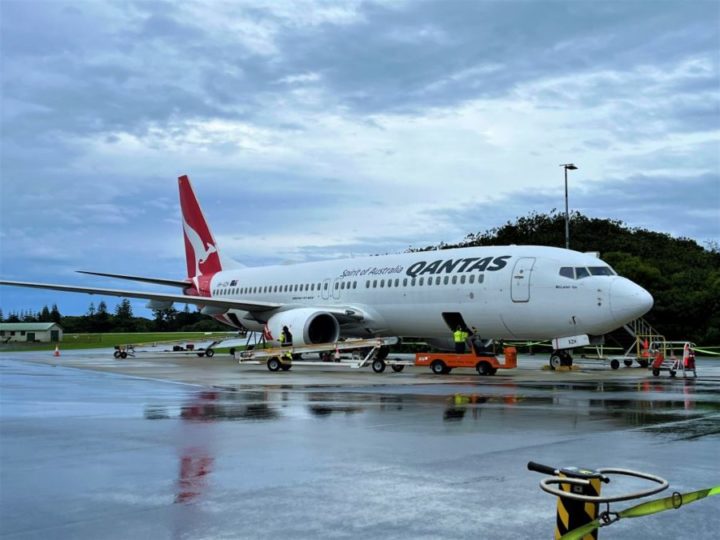 a large airplane on a wet runway