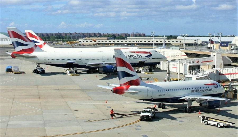 a group of airplanes at an airport