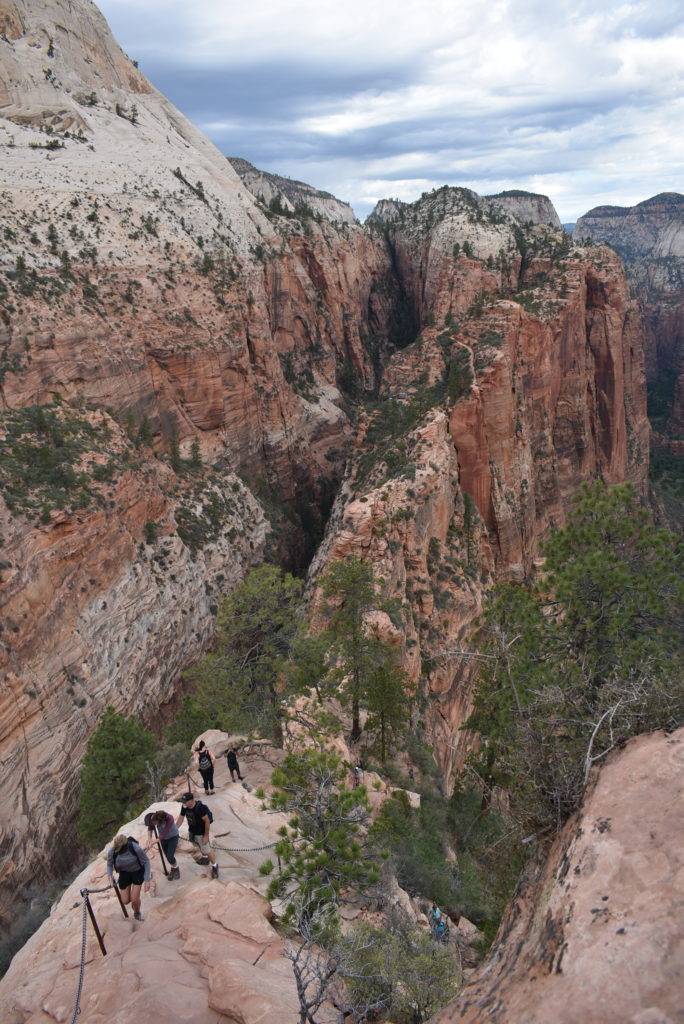 a group of people on a rock path