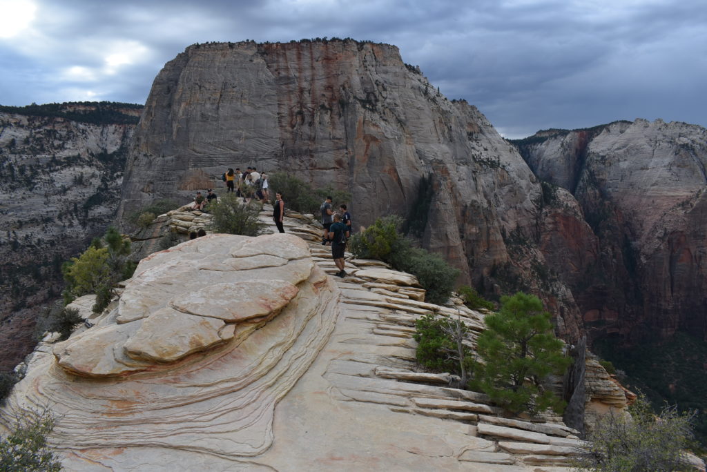 a group of people on a rock