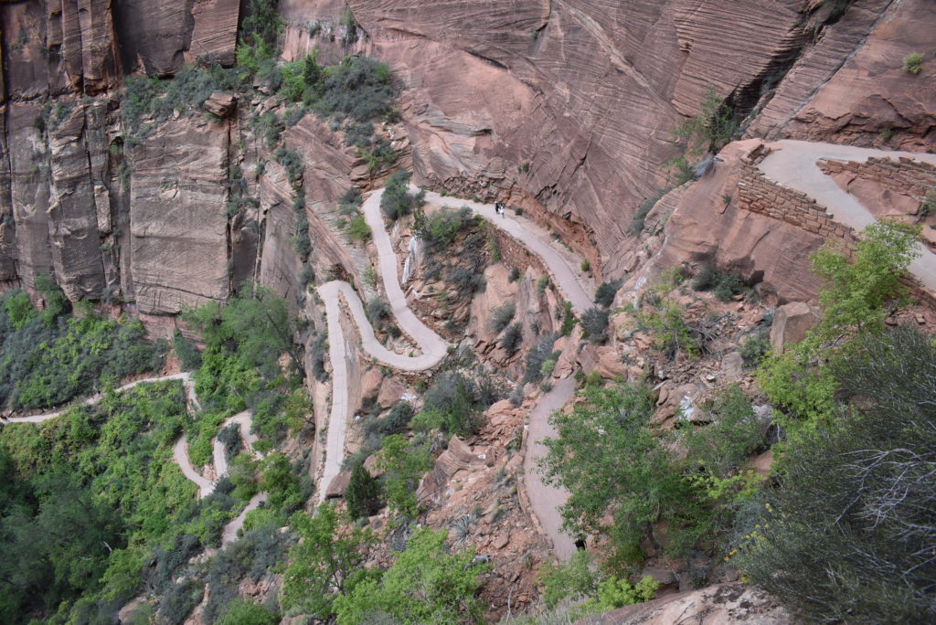 a winding road in a rocky mountain