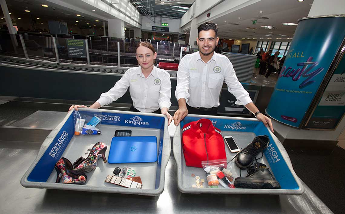 a man and woman holding luggage