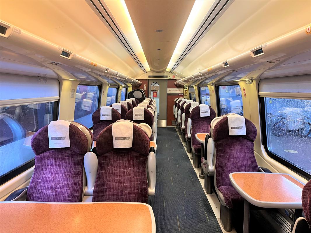 a train with seats and tables