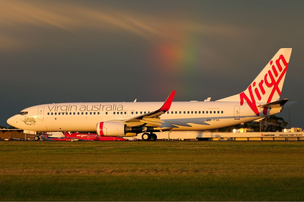 a white airplane on a runway