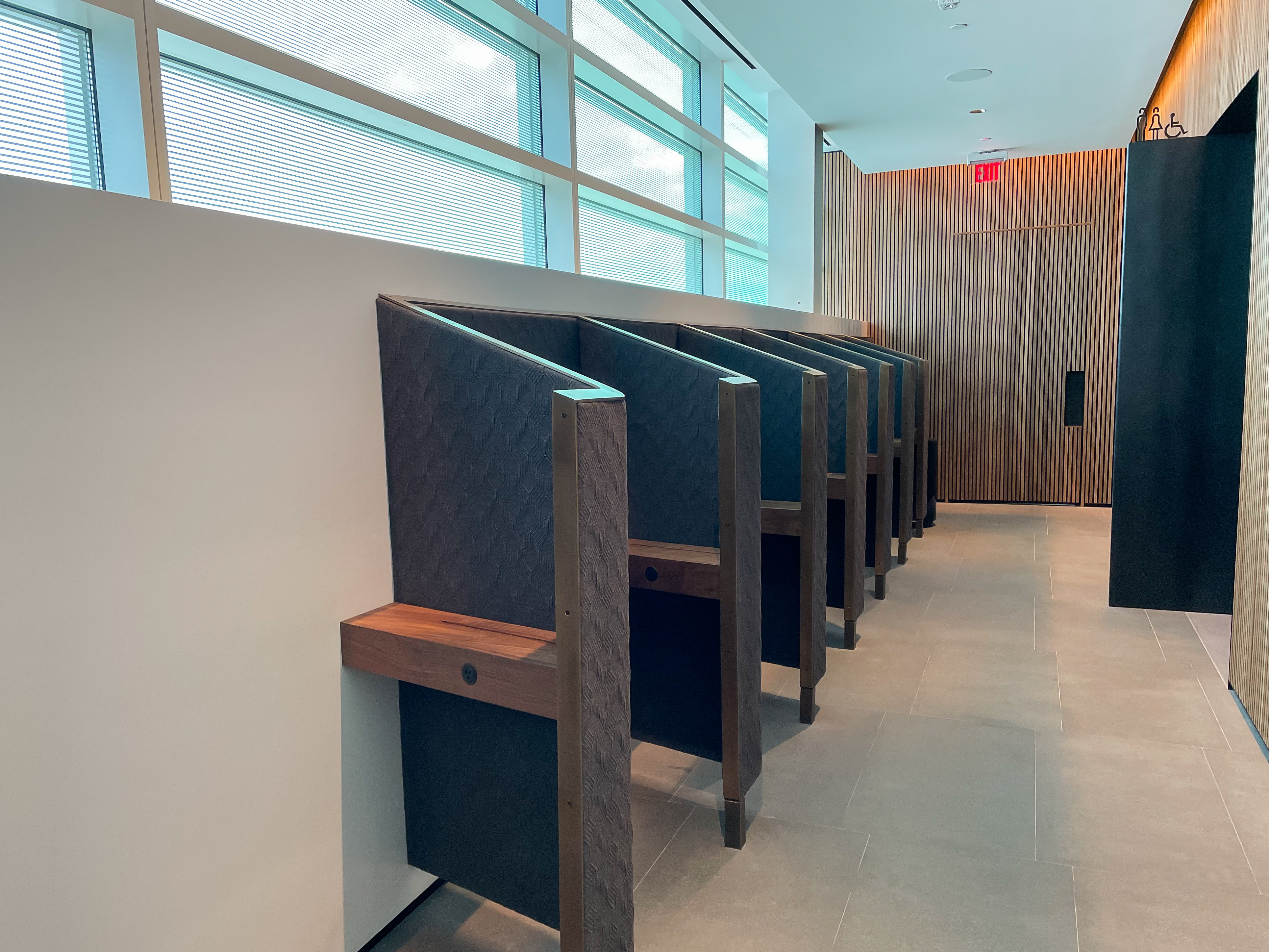 Phone booth-like workstations at the Admirals Club in Concourse E at Washington National Airport.