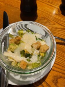 a bowl of salad on a table