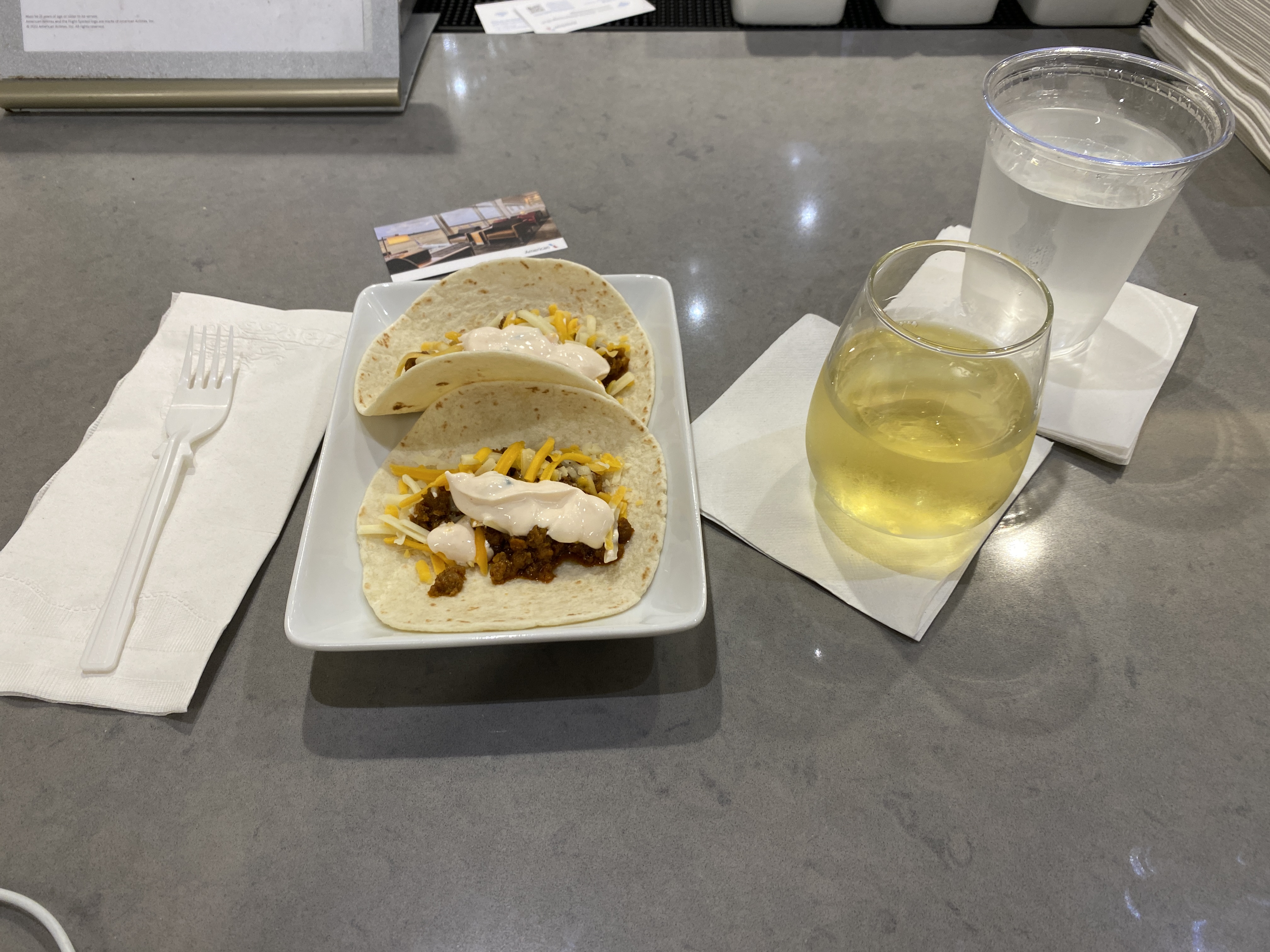 An image featuring tacos at an Admirals Club at Miami International Airport.