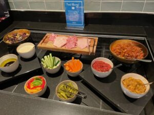 a counter with bowls of food on it