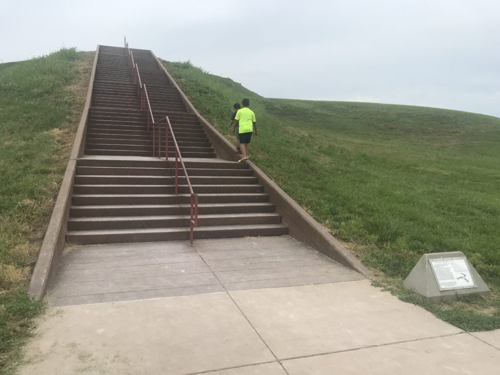 a two people walking up a set of stairs