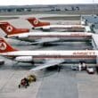 several airplanes at an airport