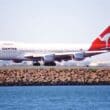 a large white airplane on a runway