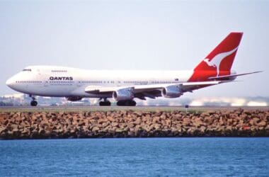 a large white airplane on a runway