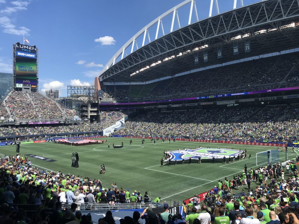 a stadium filled with people with CenturyLink Field in the background