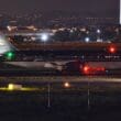 a plane on a runway at night