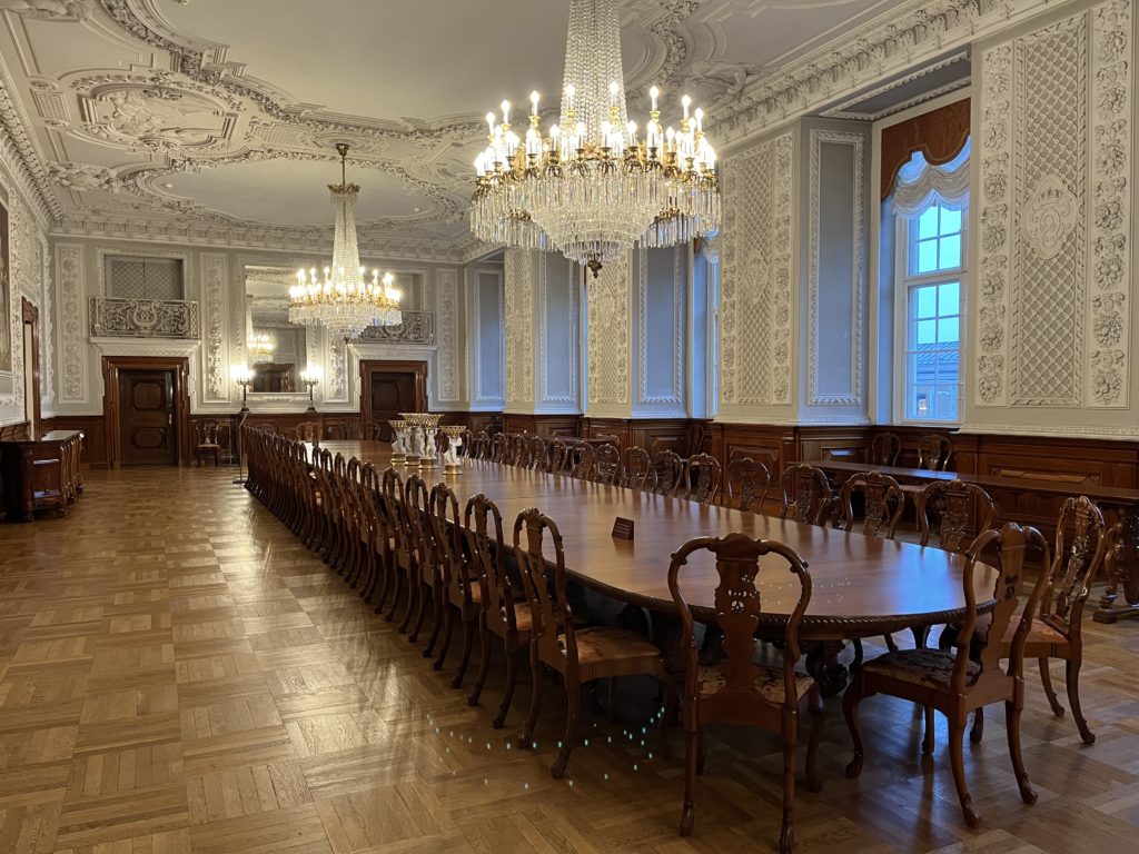 a large room with a large table and chairs