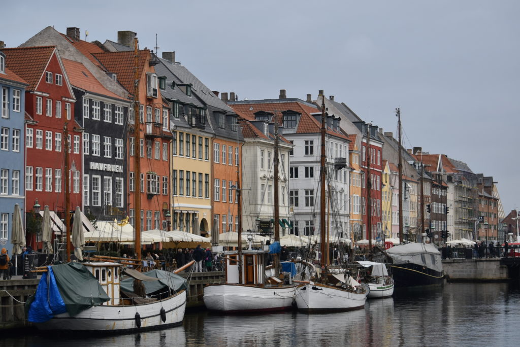 boats on the water next to buildings