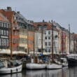 boats on the water next to buildings