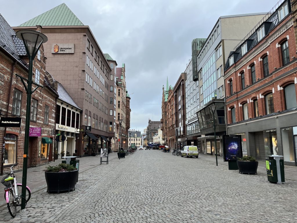 a street with buildings and cars