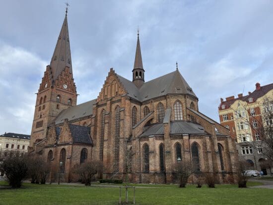 a large brick building with towers